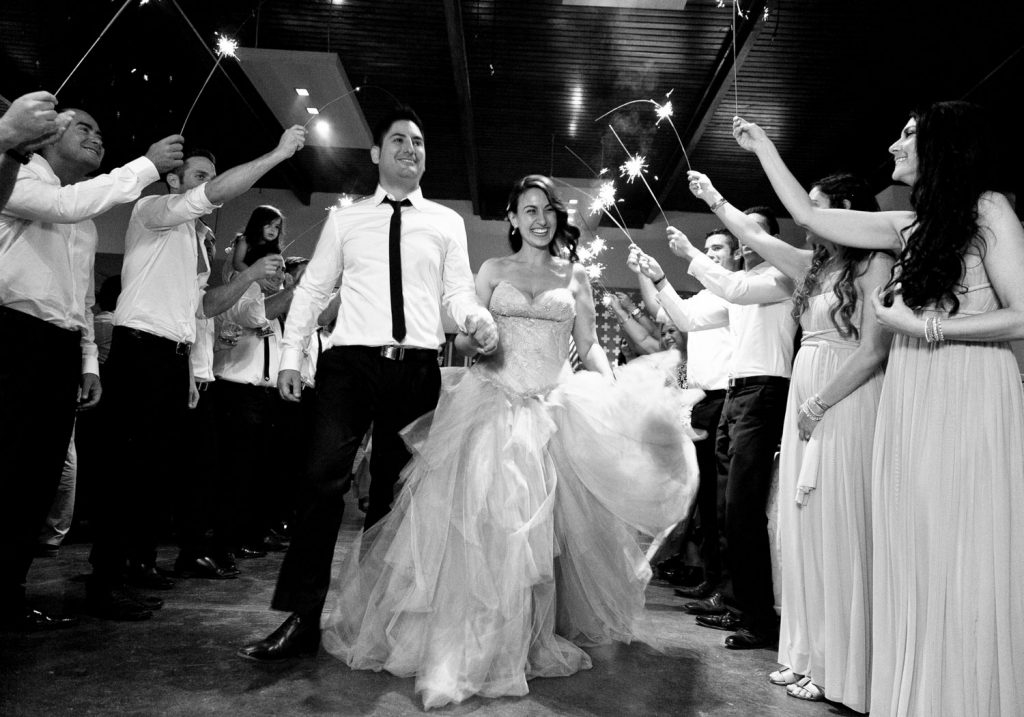 black and white image of a Jewish couple celebrating under sparkles