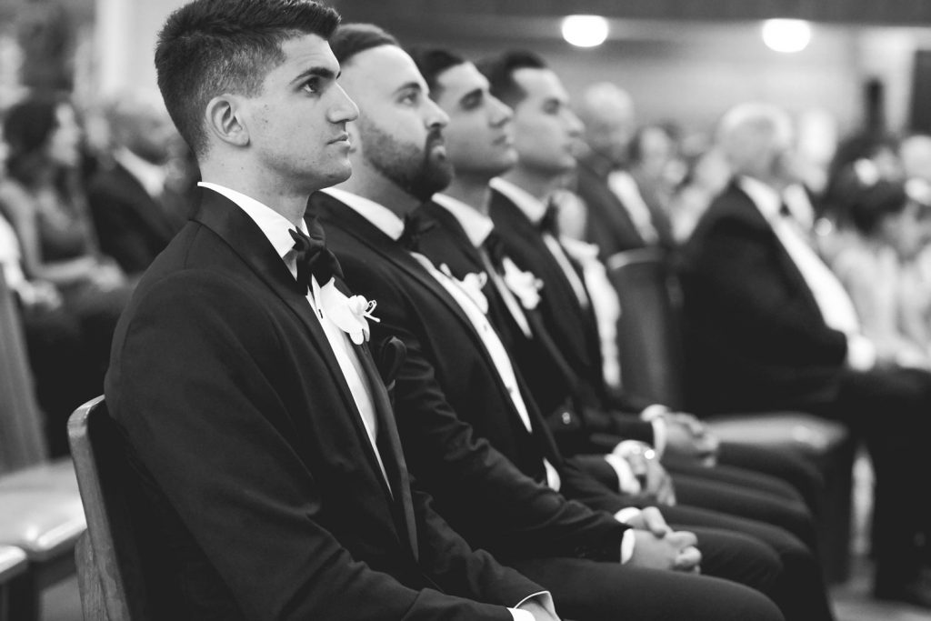 black and white image of groomsmen at Maronite Catholic Church in Woodmead