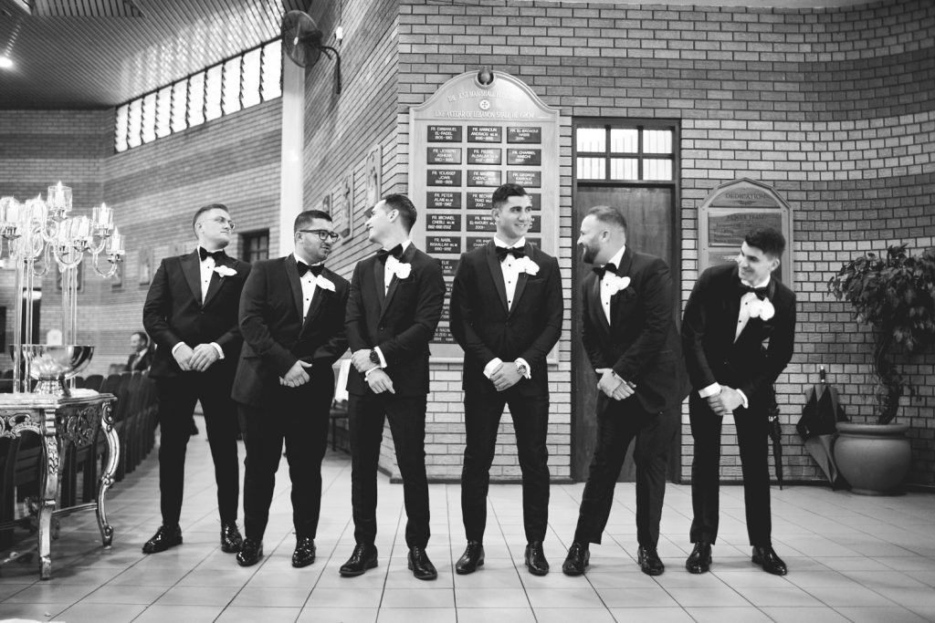 black and white image of groomsmen at the Maronite Catholic Church in Woodmead