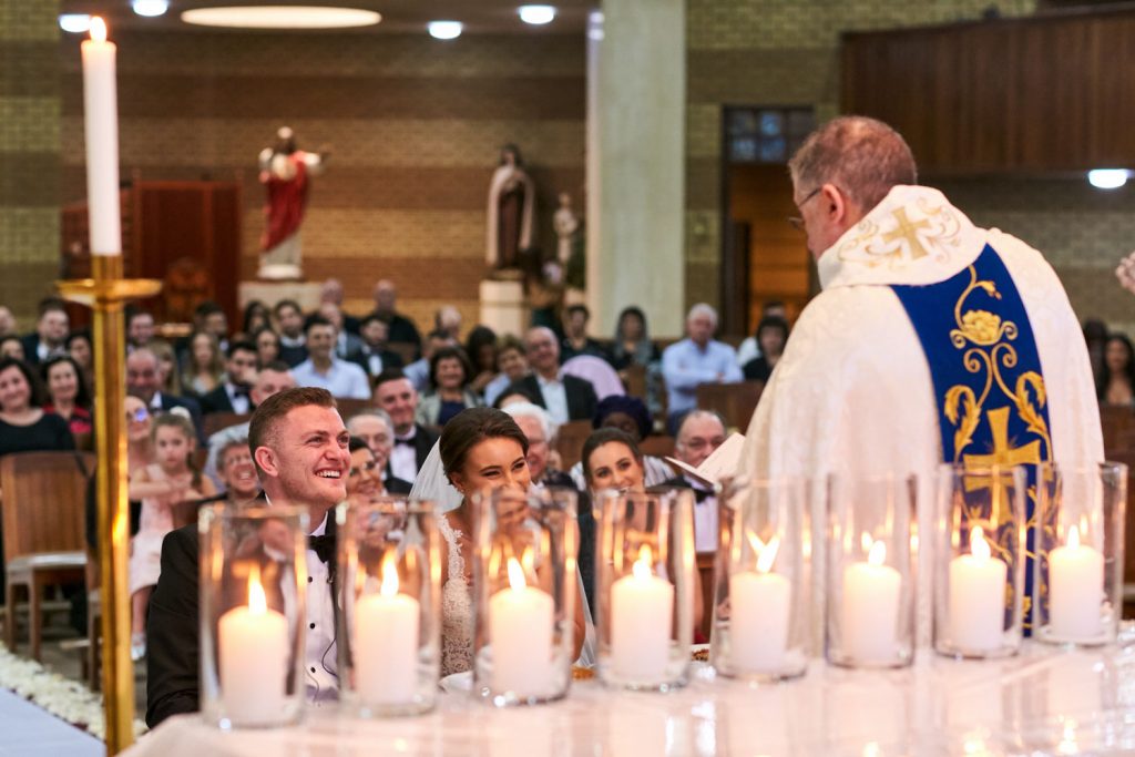 Priest talking to the Lebanese wedding couple at the Maronite Catholic Church in Woodmead
