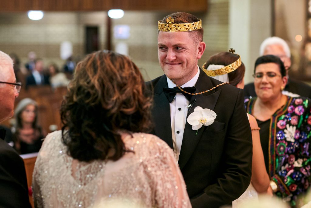 Groom smiling at Our Lady Of Cedars on Woodmead