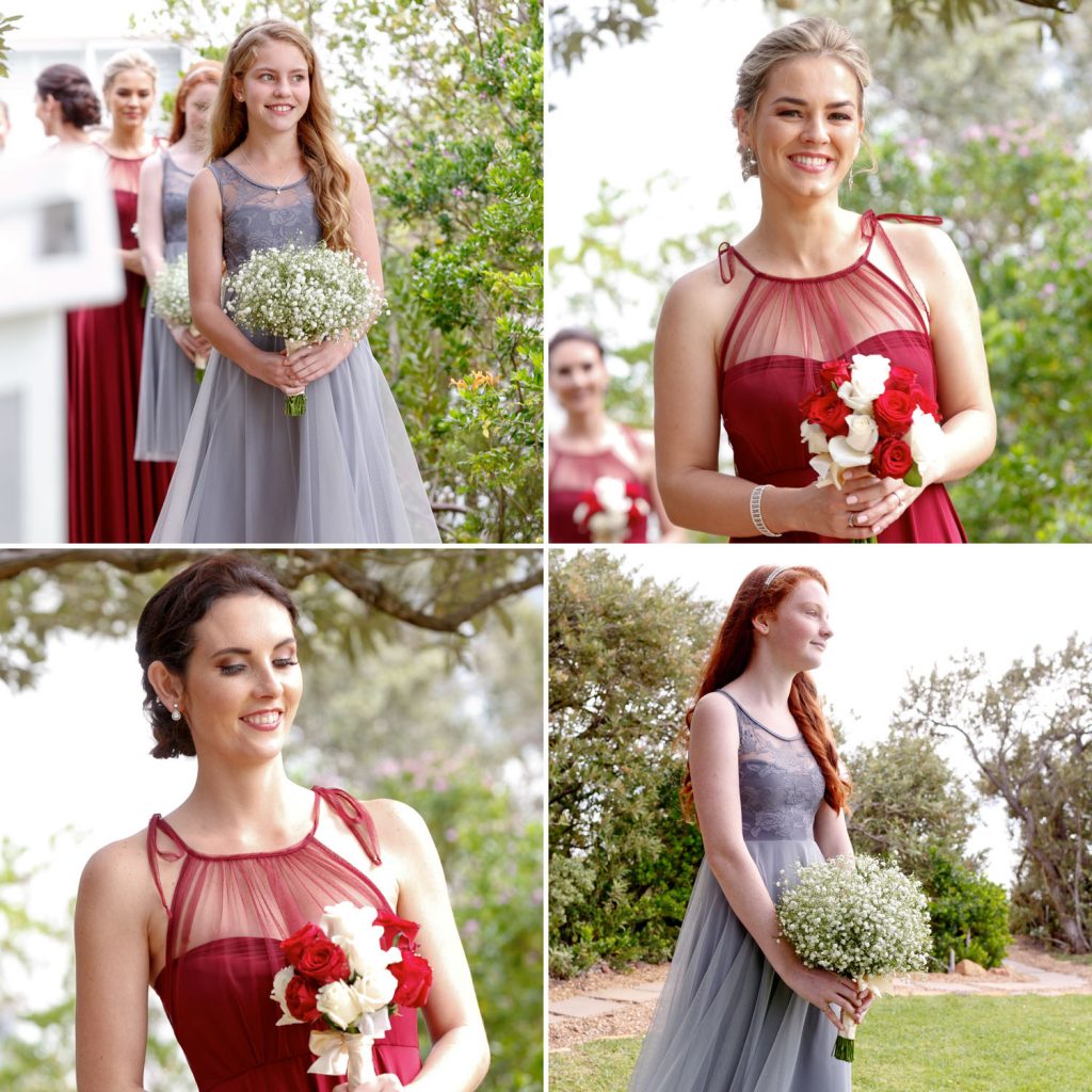 bridesmaids in red and grey dresses at the garden wedding at the Twelve Apostles Hotel in Cape Town