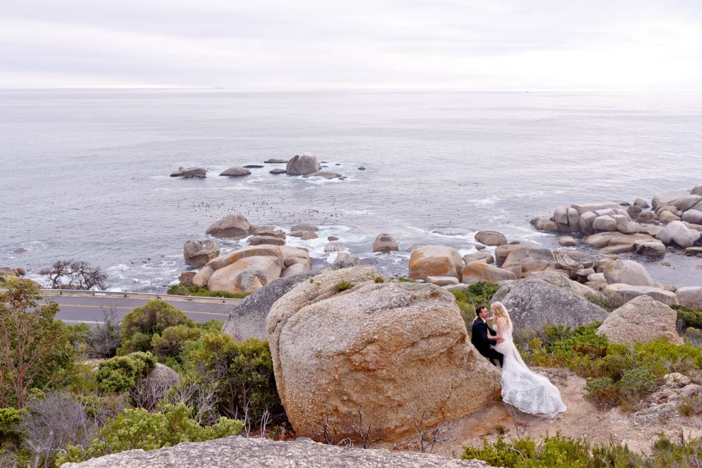 bride and groom overlooking the Atlantic Ocean at the Twelve Apostles Hotel in Cape Town