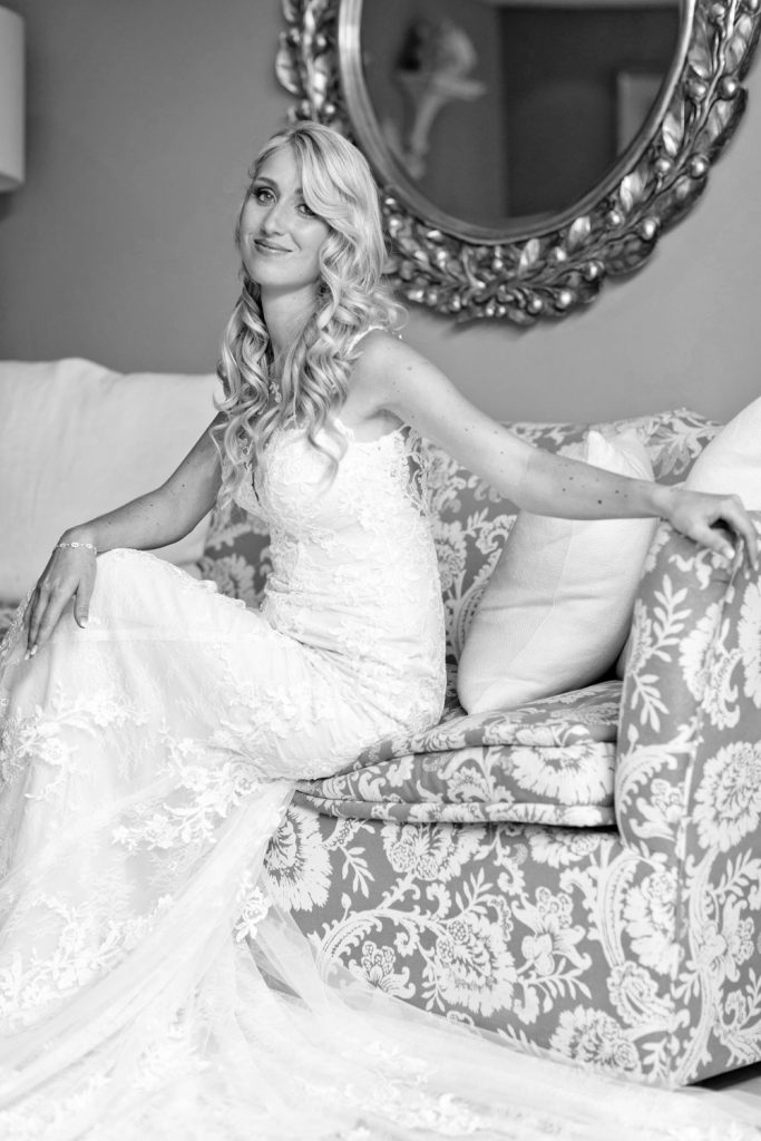 Happy bride sitting on a sofa at a Cape Town Hotel