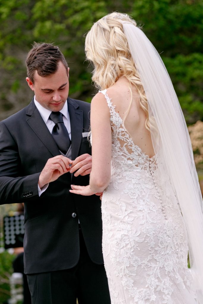 Groom and bride getting married at a garden wedding service overlooking the Atlantic Ocean in Camps Bay South Africa
