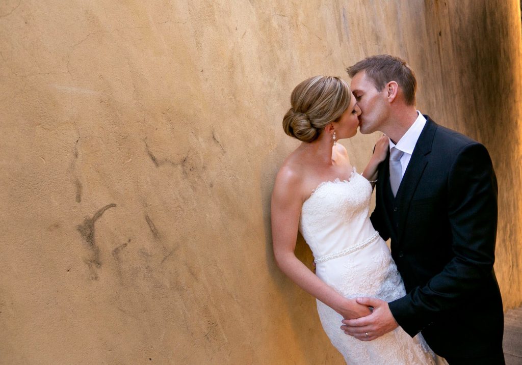 bride and groom kissing at The Palazzo Hotel Montecasino