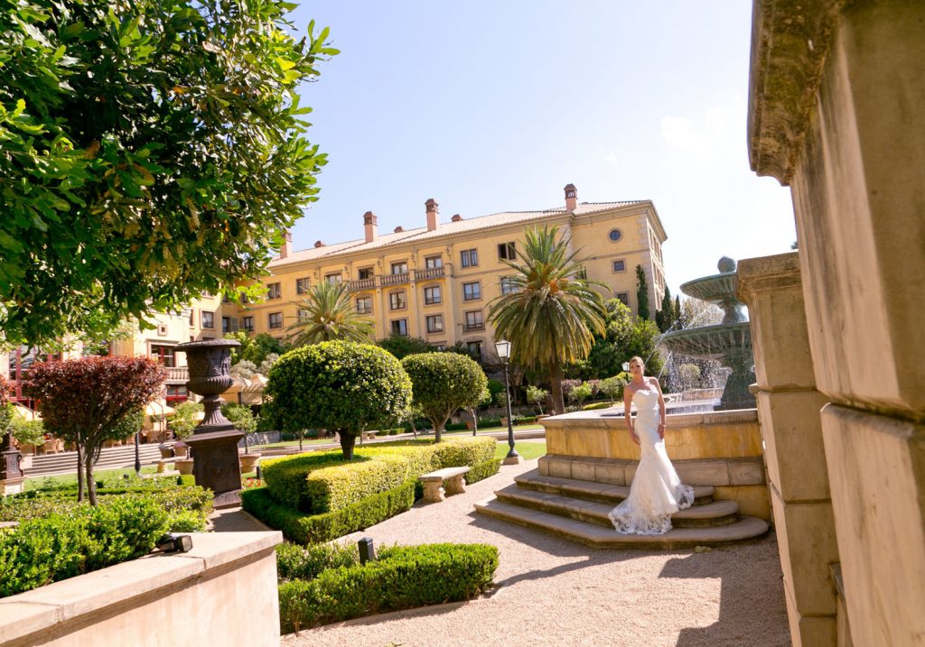 Johannesburg bride posing in front of the fountains at The Palazzo Hotel Montecasino in Johannesburg