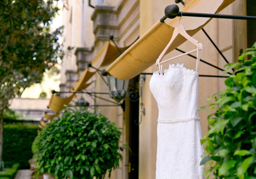 brides white wedding dress hanging outside at The Palazzo Hotel Montecasino in Johannesburg