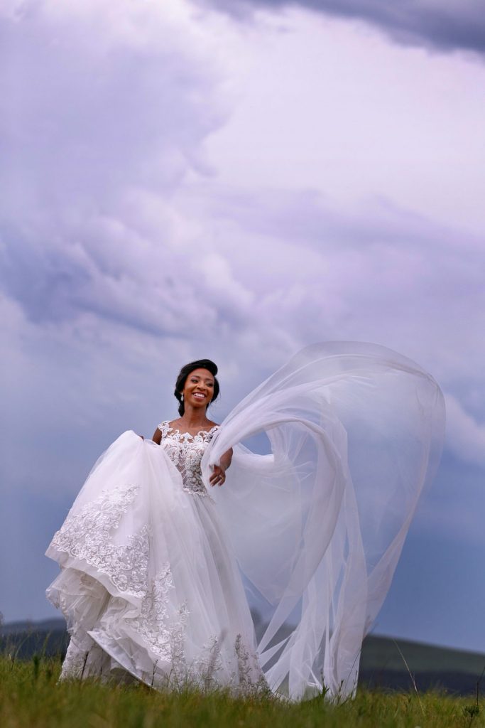 Bride walking in the clouds at Brahman Hills Nottingham in the Natal Midlands