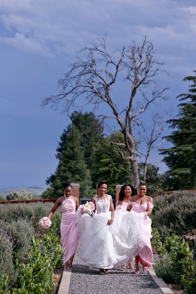 Bridesmaids dressed in pink dresses at Brahman Hills Nottingham Road in the Natal Midlands