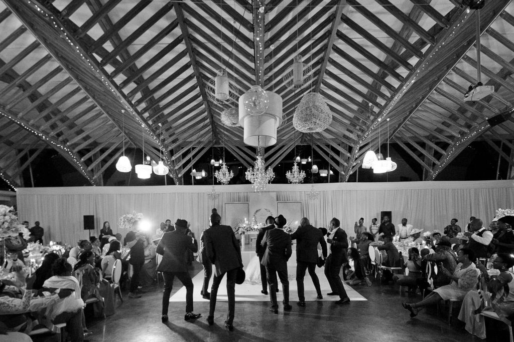 black and white dancing images of the Groomsmen at Brahman HillsWedding venue in Natal Midlands
