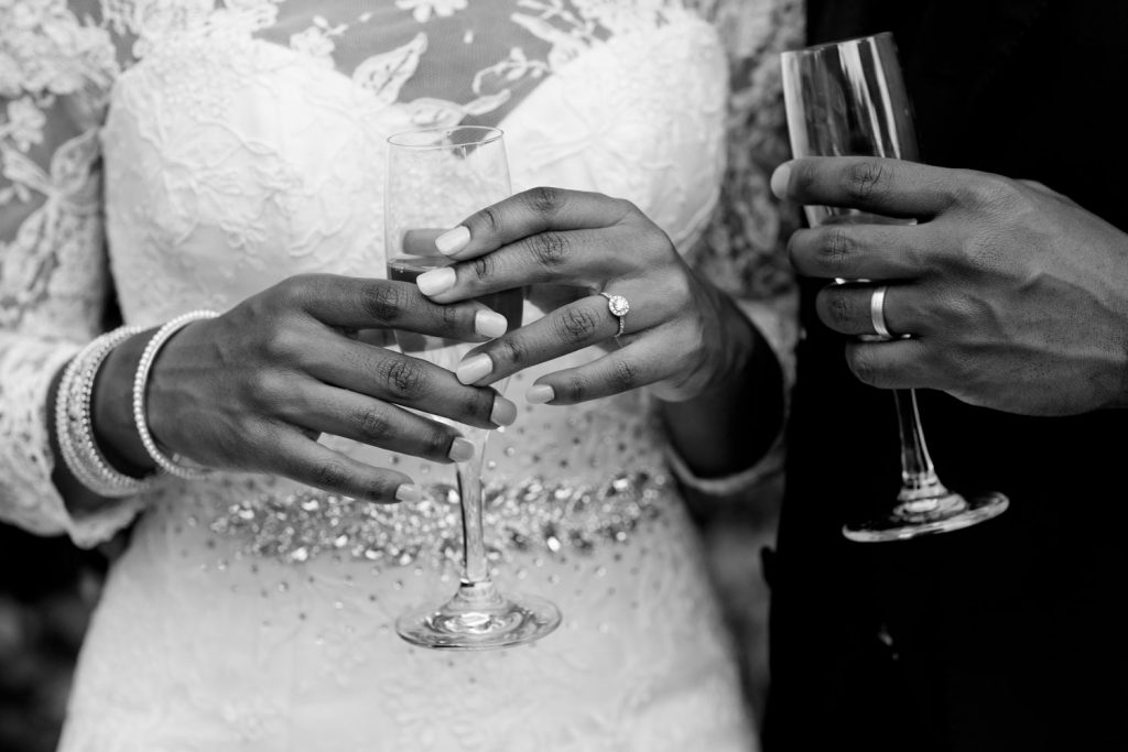 wedding couple holding champagne Glasses