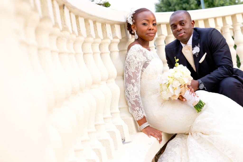 married couple sitting on the stairs at Hyde Park Wedding venue