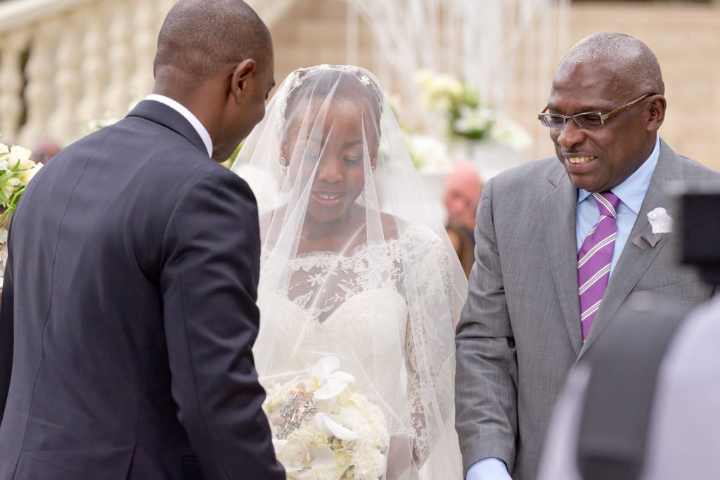 Father of the bride smiling at the groom