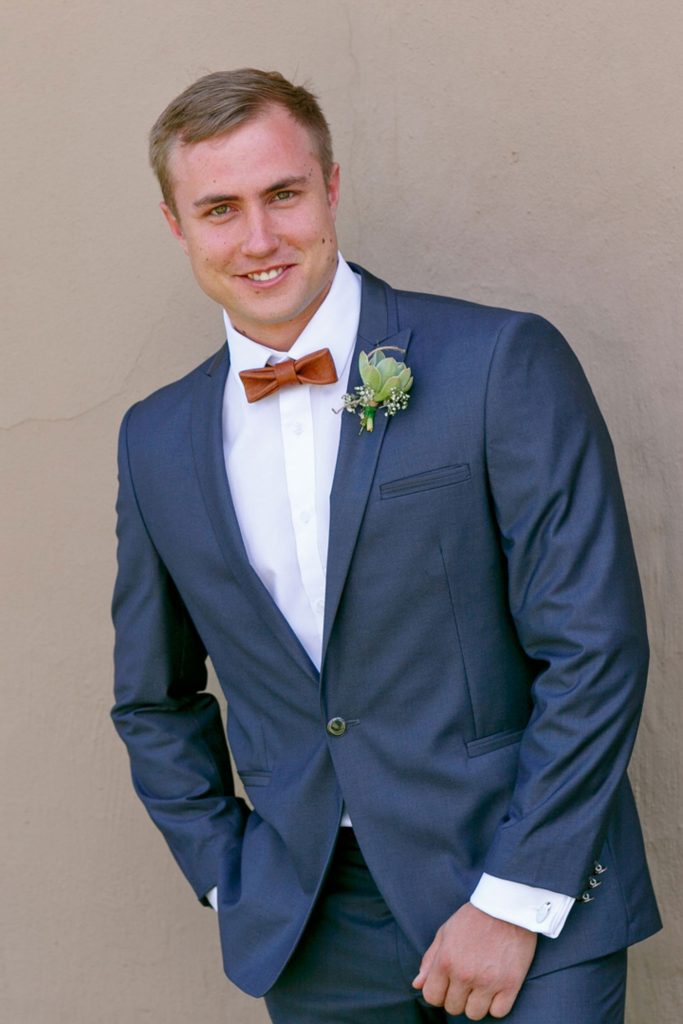 Groom in a blue wedding suit at Lezar Opstal Wedding venue