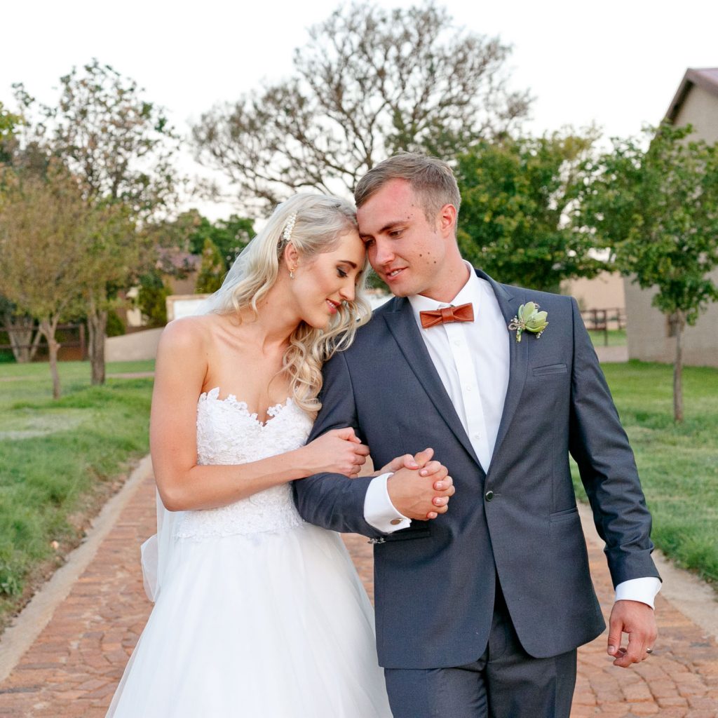 Lezar Opstal Weddings bride holding the groom