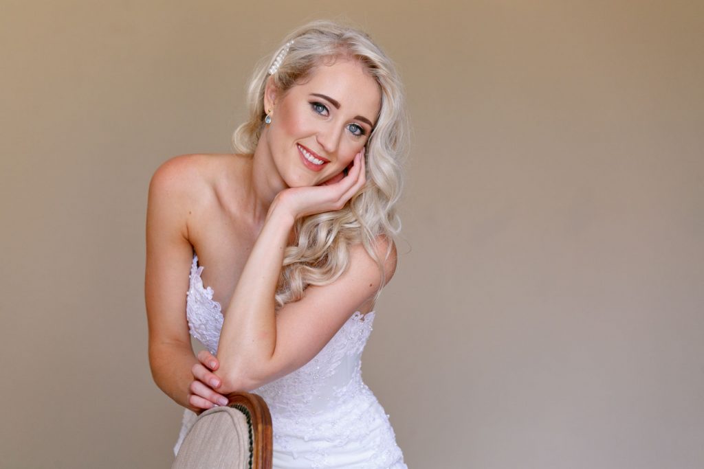 Lezar Opstal wedding Photographer photographing the bride in her white wedding dress