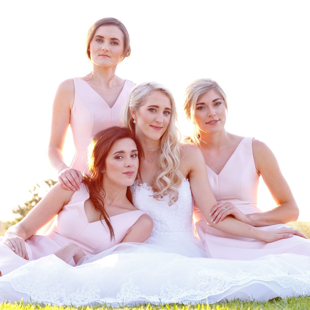 bridesmaids in pink dresses at Lezar Opstal Weddings