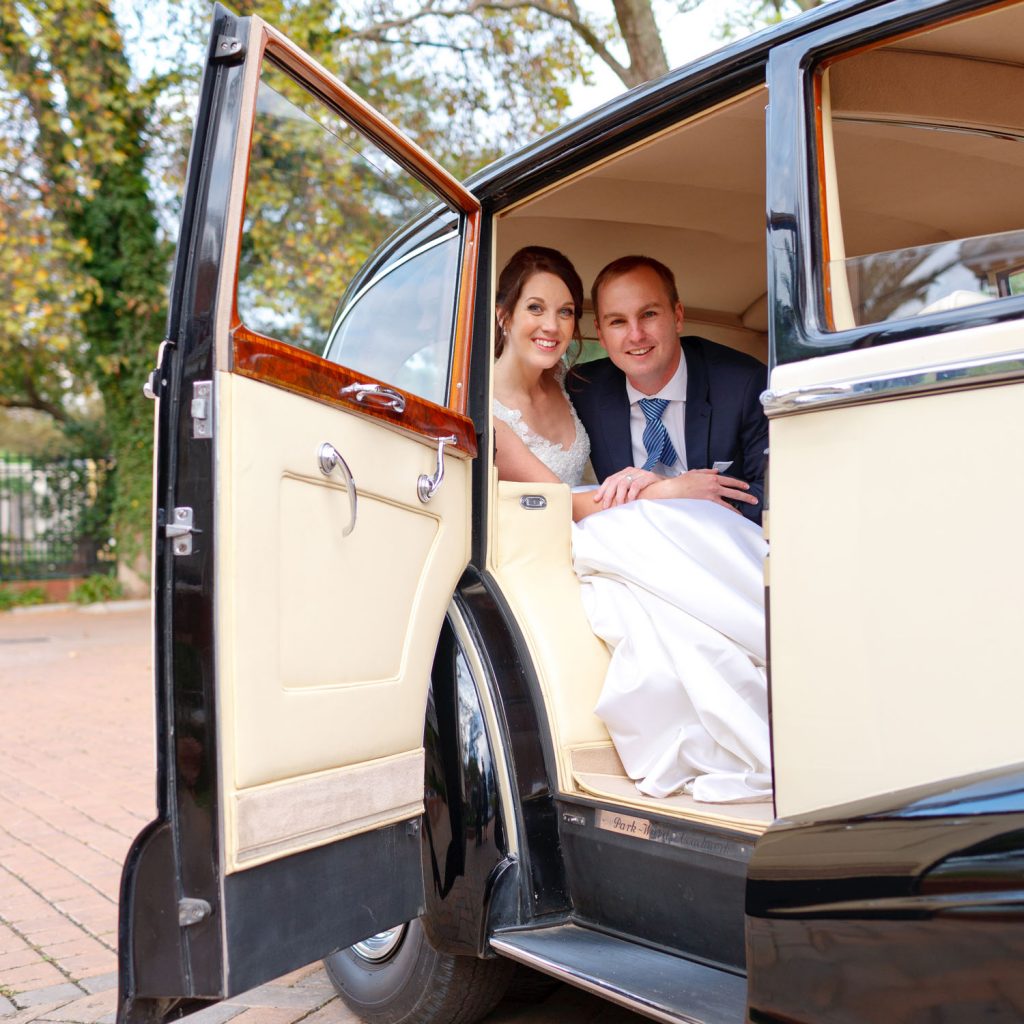 Emoyeni Estate Weddings couple sitting inside a Rolls Royce Vintage Wedding Car