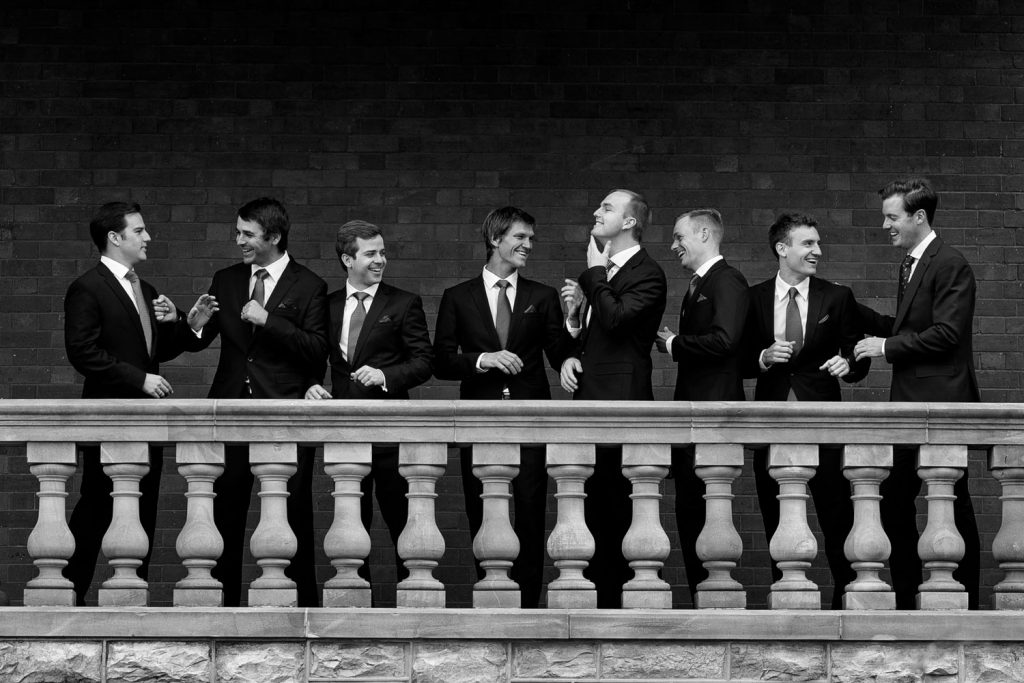 Black and white wedding group shot of the bestmen boxing at Emoyeni wedding venue