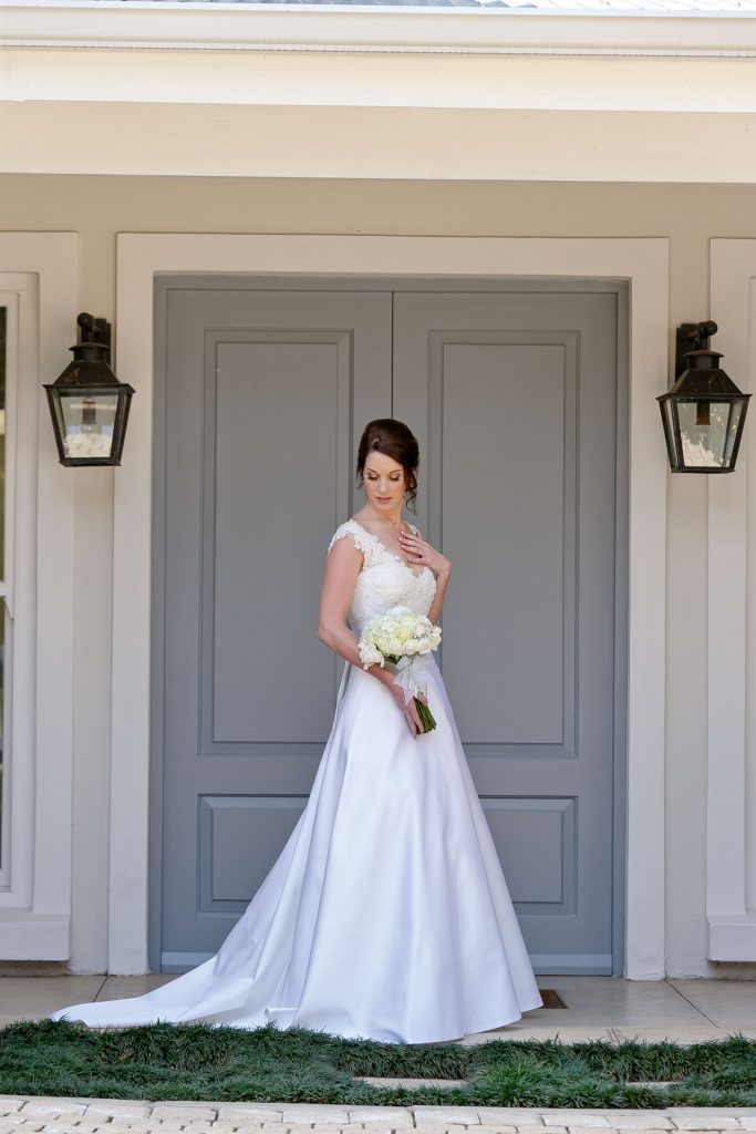 Johannesburg bride posing standing in front of blue doors