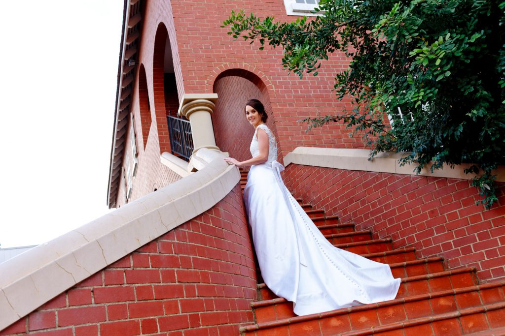 Johannesburg bride standing on the steps at Emoyeni wedding and conference venue in Johannesburg