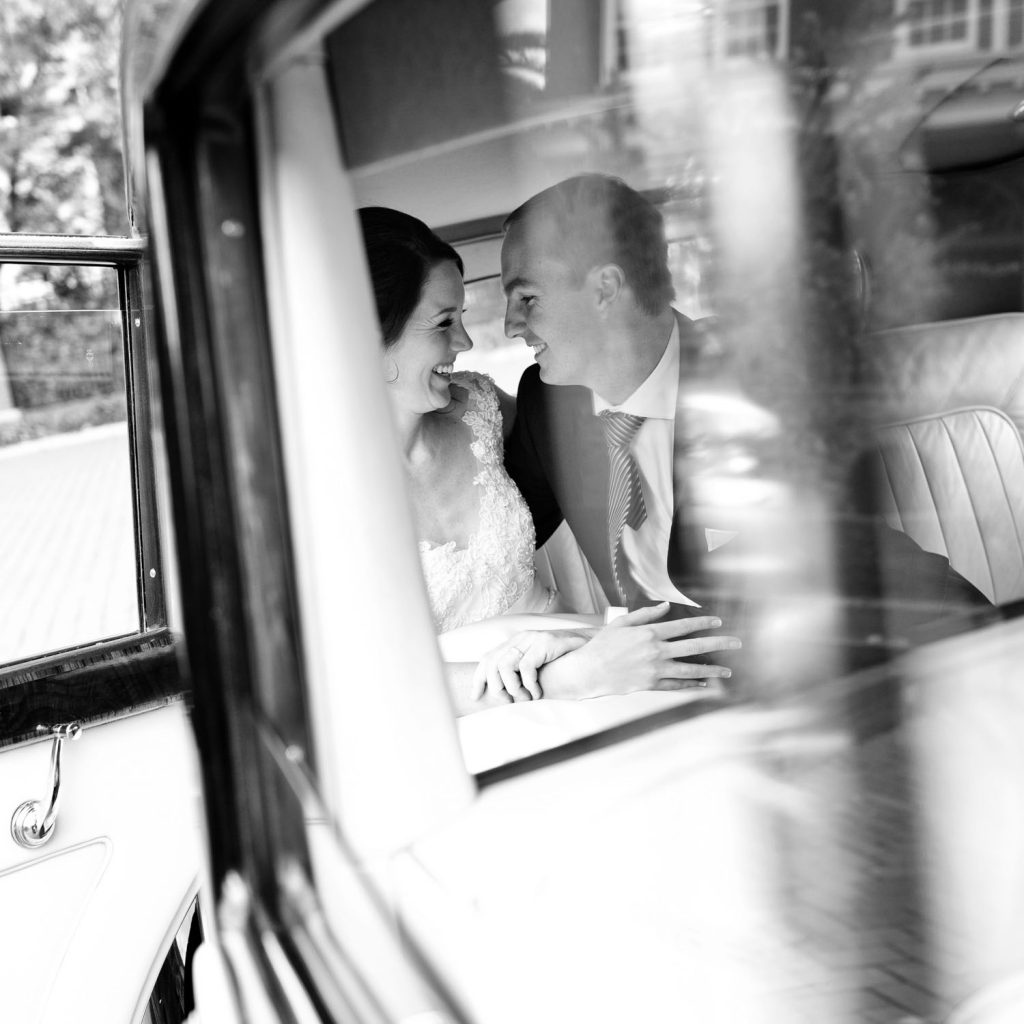 bride and groom in the wedding car at St George's Anglican Church in Parktown Johannesburg