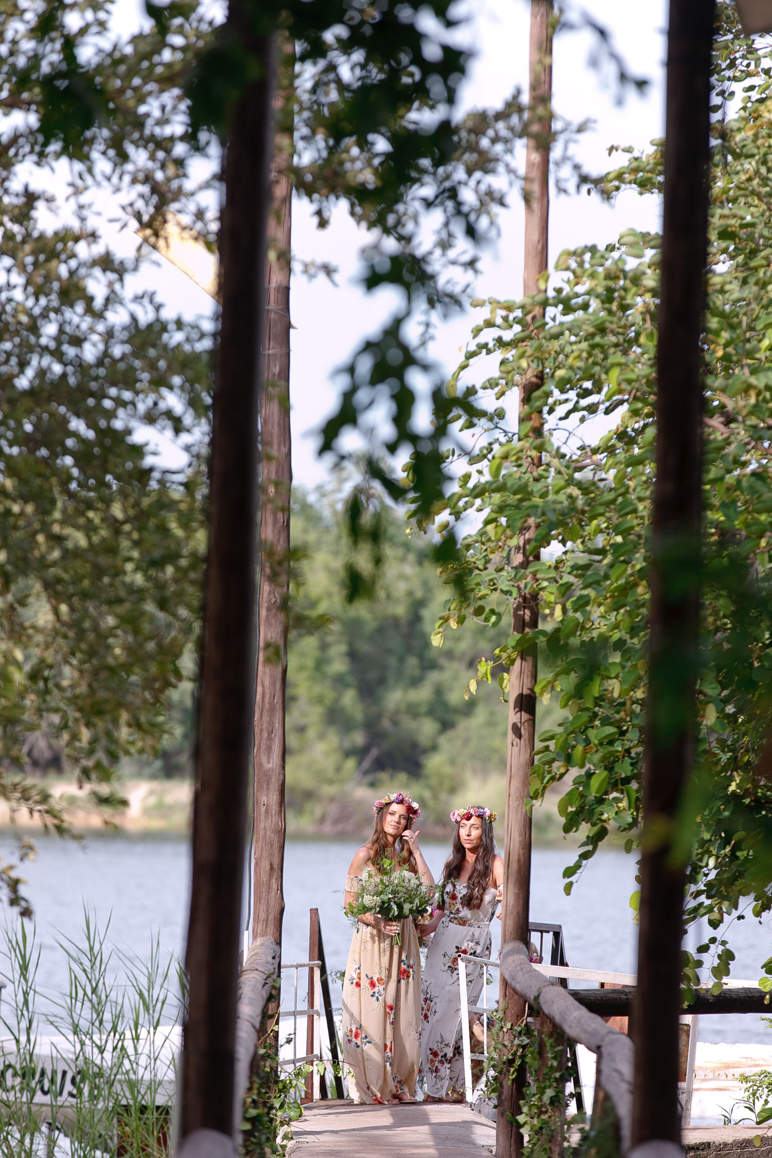 bridesmaids in pretty floral dresses waiting on the banks of the Zambezi River in Zimbabwe