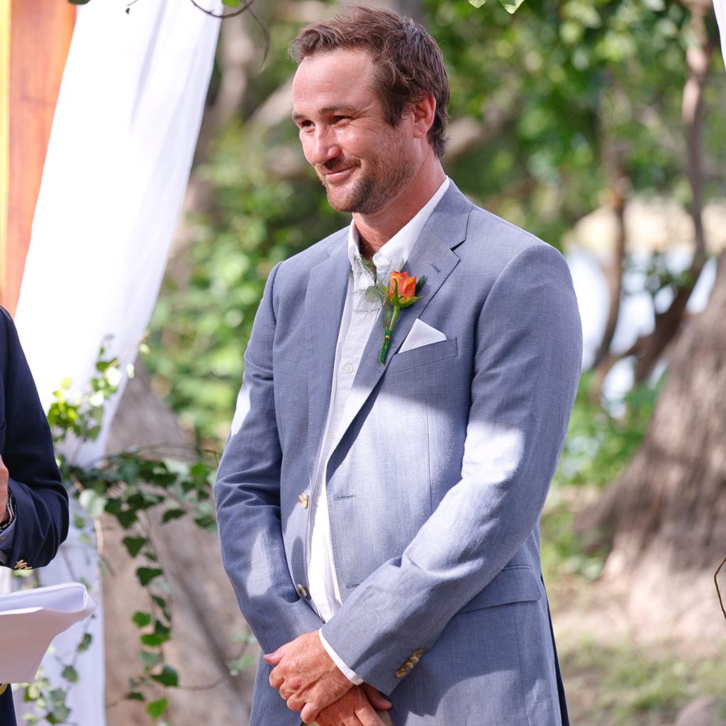 groom in a blue wedding suite at Victoria Falls Zimbabwe