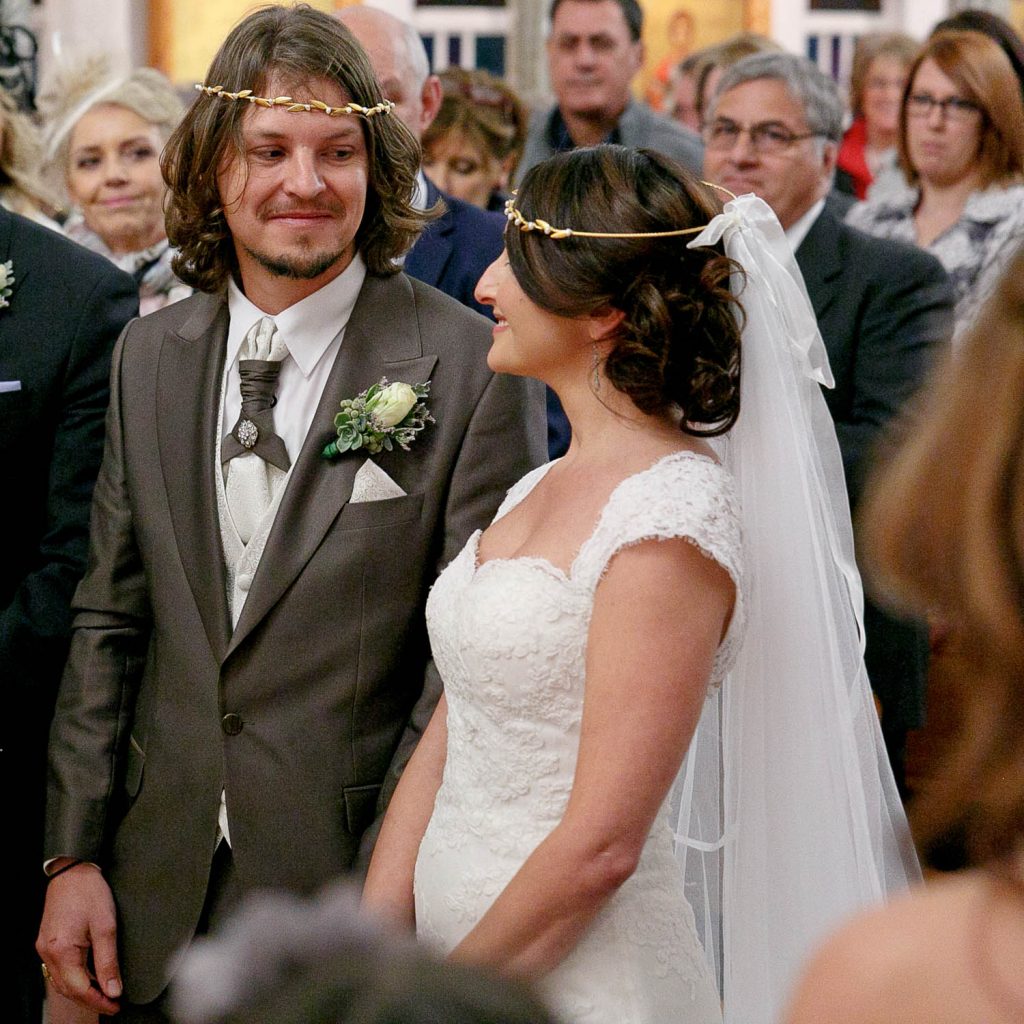Couple smiling at the Saheti Greek Orthodox Church