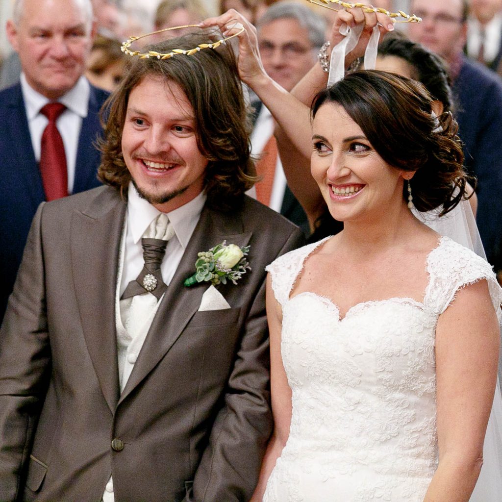 Greek couple laughing at the Saheti Greek Orthodox Church