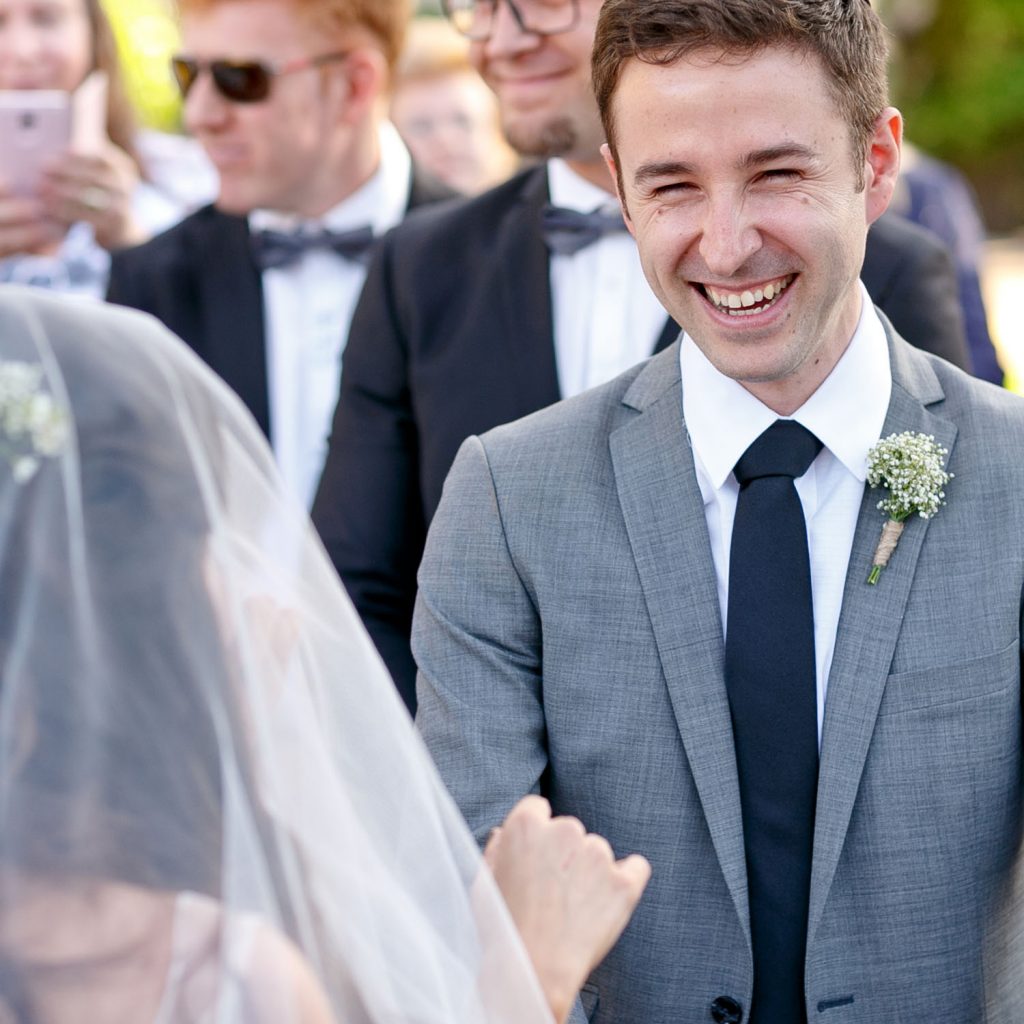 Groom smiling at his jewish wife, Shepstone Gardens in Johannesburg