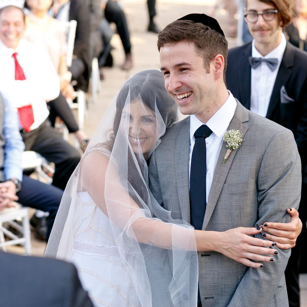 Jewish bride hugging her husband at a Jewish Wedding in Johannesburg