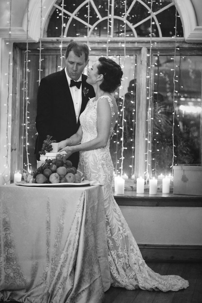 bride and groom cutting the wedding cake at Shepstone Gardens in Hope Road