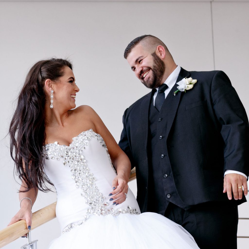 Wedding couple smiling at one another at The Wanderers Hotel in Johannesburg
